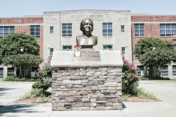 This bust of Richmond’s great lady, Maggie L. Walker, sits on Lombardy Street in front of the regional Governor’s School that bears her name. 
Mrs. Walker, an advocate for civil rights and economic empowerment, is best known for being the first African-American woman to found and become president of a bank. 
The school dedicated the bust last year in celebrating her 150th birthday on July 15. Members of the Maggie L. Walker Class of 2011 led the effort to raise the money for the commemorative bust. 
It is a bronze replica of a plaster bust of Mrs. Walker that sculptor Paul Beneduce created in 1934 for Richmond’s celebration of Maggie L. Walker Month, which took place two months before her death.