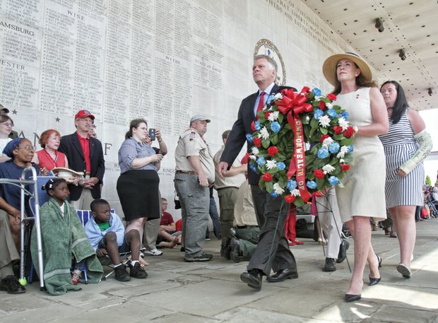 Honoring veterans and family time

More than 800 people came out Monday to salute fallen veterans during a morning ceremony on Memorial Day at the Virginia War Memorial in Downtown.

Gov. Terry McAuliffe and his wife, Dorothy, accompanied by their children, carry a wreath that was placed at the feet of the statue Memory and the Torch of Liberty eternal flame at the memorial on South Belvidere Street.