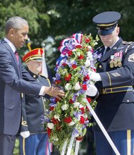 Paying homage
President Obama recognizes American service members who gave their lives for the nation during a Memorial Day ceremony at Arlington National Cemetery in Northern Virginia. The president places a wreath at the Tomb of the Unknowns with the assistance of Sgt. 1st Class John C. Wirth. 