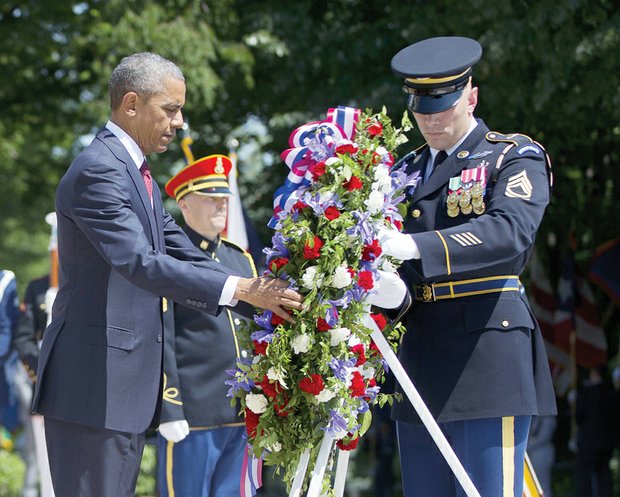 Paying homage
President Obama recognizes American service members who gave their lives for the nation during a Memorial Day ceremony at Arlington National Cemetery in Northern Virginia. The president places a wreath at the Tomb of the Unknowns with the assistance of Sgt. 1st Class John C. Wirth. 