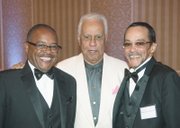 former Gov. L. Douglas Wilder, center, talks with the grandsons of an ODBA founder, Frederic Charles Carter Sr., at Saturday night’s banquet. They are Scott H. Carter, left, and Frederic Charles Carter III.