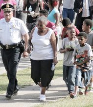 Richmond Police Chief Alfred Durham works at strengthening community ties by attending community meetings and leading anti-violence rallies, including this one May 12 in the Mosby Court public housing community. 