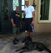 Manuel Golden with satisfied client Dwight Howard Belgian Malinois