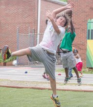 Jonathan Massenberg II doesn’t let height or age trump him. The youngster went airborne to snag the football missed by volunteer Aidin Gonzalez at the Friends Association for Children’s Community Health Fair last Saturday in Gilpin Court. In addition to cooking demonstrations, health screenings and fitness classes, the fair featured a Kids Fun Zone where youngsters tossed footballs, hurled water balloons and enjoyed face painting.