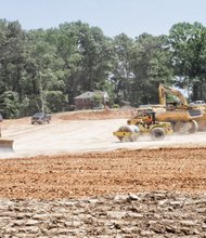 Heavy equipment prepares the ground for a new subdivision in South Side — fresh evidence that Richmond’s housing market finally is rebounding from the great recession. The $14 million development, called Riverside Heights, is expected to result in 59 upscale townhouses in the 5700 block of Bliley Road near Stony Point Fashion Park. The subdivision, expected to feature three-bedroom townhomes starting at $220,000, won rezoning approval in July 2012. Ryan Homes is undertaking the development.