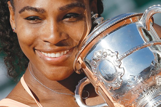 Serena Williams holds her trophy after winning the French Open championship Saturday in three sets at Roland Garros Stadium in Paris. It was her 20th Grand Slam title.