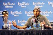 Golden State Warriors guard Andre Iguodala, above, talks about his selection as the NBA Finals MVP as he meets the media after the championship game Tuesday night in Cleveland.