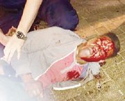 

Bloodied University of Virginia student Martese Johnson is held down by an ABC agent after being slammed to the ground March 17 outside a Charlottesville pub.