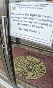 A sign at Cedar Street Baptist Church in the East End exemplifies the heightened interest in safety of worshippers.