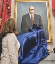 Gov. Terry McAuliffe, right, and his wife, Dorothy McAuliffe, are joined by Oliver W. Hill Jr., as they unveil a portrait of his father, legendary civil rights attorney Oliver W. Hill, at the Executive Mansion.