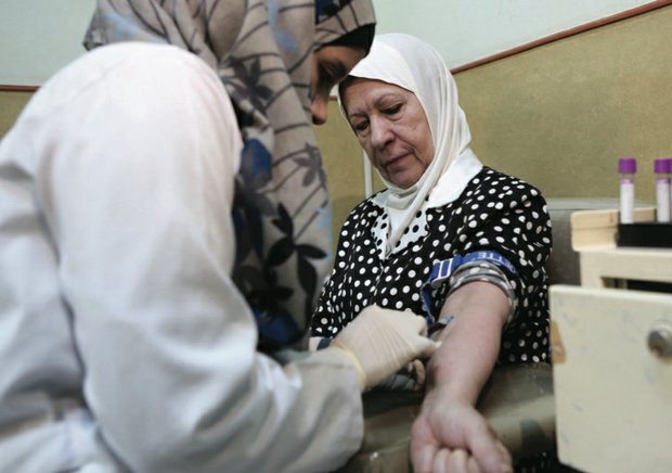 A nurse in Amman, Jordan, draws blood from a patient at Jordan’s National Center for Diabetes. The center is particularly busy ahead of Ramadan, when many Muslims seek advice on whether they can observe the sunrise to sunset fast during the holy month.