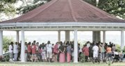 People gather Monday in Chimborazo Park in the East End to participate in a prayer vigil for the nine people who were murdered in Charleston, S.C.