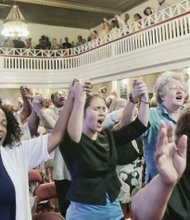 Worshippers sing “We Shall Overcome” at the unity rally at Third Street Bethel AME Church in Downtown last Friday to honor the South Carolina shooting victims