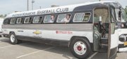 Frank J. Thornton, right, chairman of the Henrico County Board of Supervisors, and Supervisor Richard W. “Dick” Glover try out the bus the Anderson Monarchs rolled in on. It’s a replica of a 1947 Flxible Clipper like the one used by the Kansas City Monarchs. The only “air conditioning” comes from opening the windows.