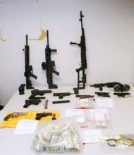 Twelve firearms, approximately $50,000, nearly a half-kilogram of heroin and over one-half kilogram of cocaine were seized during the arrests of 32 of the charged defendants.