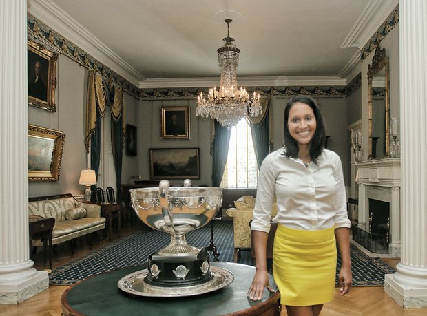 Kaci Easley shows off a portion of the ornate first floor of the 19th century mansion that has served as the residence for 55 governors since it opened in 1813.