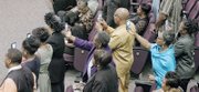 Audience members capture poignant moments on their cell phones during the homegoing service for Maggie Ingram, the revered gospel performer who led Maggie Ingram and The Ingramettes for more than six decades.