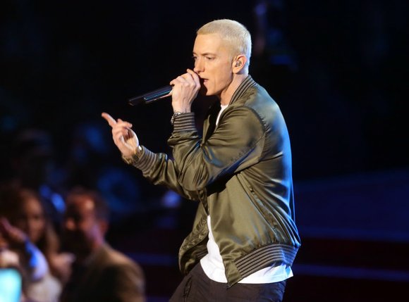 The British pop sensation reveals that he used the swears of Marshall Mathers to overcome a disability.