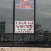 A sign advertising a need for cashiers is posted at the Currency Exchange on Larkin Avenue near Plainfield Road in Joliet.