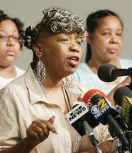 Eric Garner’s mother, Gwen Carr, center, is joined by his daughter, Emerald Snipes, left, and widow, Esaw Garner, at a news conference Tuesday in New York. The family spoke after reaching a $5.9 million settlement with the city in the wrongful death case of Mr. Garner, who died after being placed in a chokehold by a white police officer.