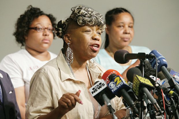 Eric Garner’s mother, Gwen Carr, center, is joined by his daughter, Emerald Snipes, left, and widow, Esaw Garner, at a news conference Tuesday in New York. The family spoke after reaching a $5.9 million settlement with the city in the wrongful death case of Mr. Garner, who died after being placed in a chokehold by a white police officer. 