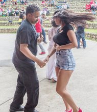 RHYTHM OF THE BEAT- The rhythmic sounds of Latin jazz filled the air last Saturday at Dogwood Dell in Byrd Park as dancers twirled and twisted at the 8th Annual Latin Jazz and Salsa Festival. A slew of performers, dancers and jazz musicians inspired the dancers — young and old — to show off their fancy footwork. Michael Douglas and Giuliana Roggiero.
