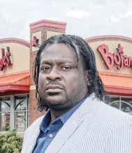 Bojangles’ customer James “J.J.” Minor feels insulted by a manager’s remark made when he returned fast food chicken box filled with cash.