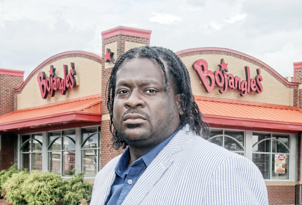 Bojangles’ customer James “J.J.” Minor feels insulted by a manager’s remark made when he returned fast food chicken box filled with cash.