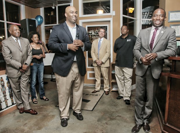 Lamont Bagby, the newest member of the House of Delegates, center, talks with supporters Tuesday night during his victory celebration at a Shockoe Bottom restaurant. They are, from left, Mayor Dwight C. Jones; restaurant owner Genet Semere; Grant Neely, the mayor’s chief of staff; the Rev. Tyrone E. Nelson of the Henrico County Board of Supervisors; and Levar Stoney, secretary of the commonwealth