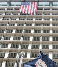 This giant American flag is draped outside the Observation Deck on the 18th floor of City Hall. Mayor Dwight C. Jones had the nearly three-story banner unfurled from the top floor last week in response to a visit from the Sons of Confederate Veterans in Downtown. The flag, which reaches down to the 16th floor, is prominently on display on the Broad Street side of the building.