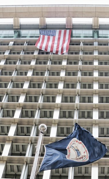 This giant American flag is draped outside the Observation Deck on the 18th floor of City Hall. Mayor Dwight C. Jones had the nearly three-story banner unfurled from the top floor last week in response to a visit from the Sons of Confederate Veterans in Downtown. The flag, which reaches down to the 16th floor, is prominently on display on the Broad Street side of the building.