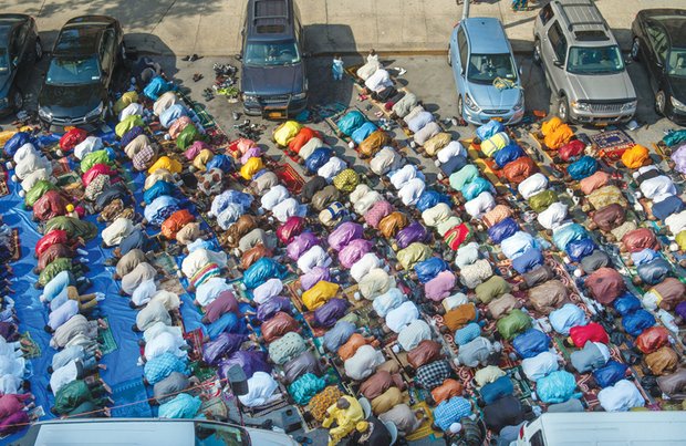 Worshipers in New York’s East Harlem neighborhood take part in the traditional prayer marking the end of Ramadan with the Eid al-Fitr holiday on July 17. Prayers took place outside the Masjid Aqsa-Salam mosque. 