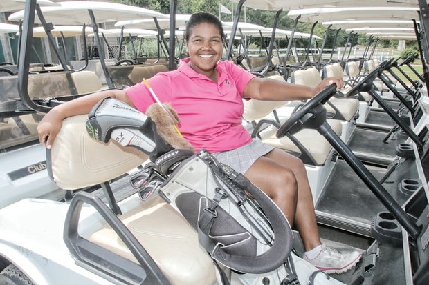 Golf champion Addie Parker, 15, credits her dad for starting her on the links when he ran out of partners to play with. She works this summer conducting golf clinics for youngsters at First Tee.