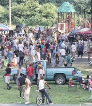 NORTH SIDE REUNION- Old friends — and new ones — gathered last Saturday in Battery Park for food and fun at the 23rd Annual Northside Re- union. Hundreds of people who live or once lived on the city’s North Side shared in the good times.