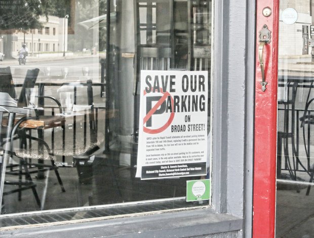 
Business owners and residents along Broad Street and the Fan are posting signs protesting the loss of parking spaces on Broad Street because of GRTC’s planned bus rapid transit.