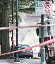 Thick smoke filled the air when an underground transformer exploded about 11:20 a.m. last Friday near 6th and Main streets in Downtown. Multiple explosions followed, sending flames through some manhole covers as high as 20 feet in the air. Dominion Virginia Power switched off electricity in the area to prevent further explosions. About 400 people were evacuated from nearby buildings, with a few people treated at the hospital for smoke inhalation. The temporary power outages caused some businesses to close for the day. 