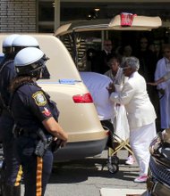 Whigham Funeral Home employees put the coffin of Bobbi Kristina Brown into a hearse Monday as they prepare to leave for the private burial in a Newark, N.J., cemetery. Both the burial and a memorial service last Saturday at a suburban Atlanta church were closed to the public and the media. 