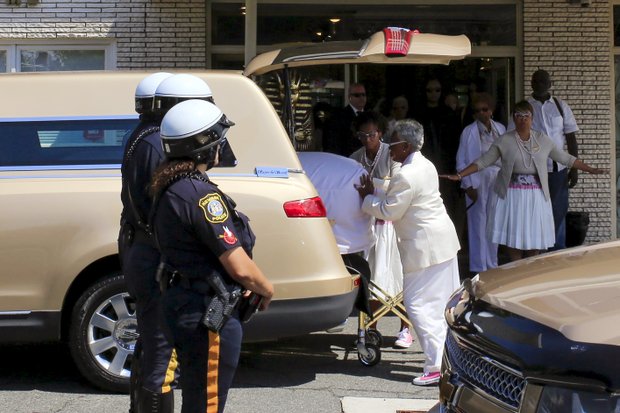 Whigham Funeral Home employees put the coffin of Bobbi Kristina Brown into a hearse Monday as they prepare to leave for the private burial in a Newark, N.J., cemetery. Both the burial and a memorial service last Saturday at a suburban Atlanta church were closed to the public and the media. 