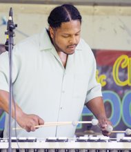 Music, food and fun - Curvey Reid with Curv Appeal playsthe vibraphone. The event blends food
and traditional and contemporary jazz with raffles, games and other activities.