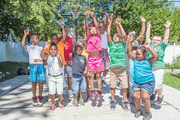 The sounds of happy children fill the air behind the two-story home of Lena Robinson and Loretta Wallace in Highland ...