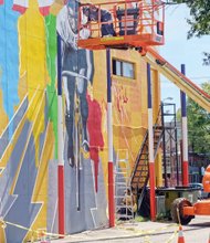 Celebrating ‘the Black Cyclone’-
this new mural in Jackson Ward pays homage to forgotten American cycling superstar — Marshall Walter “Major” taylor. Richmond artist sir James thornhill created the colorful mural featuring the two-wheel racing phenom. Location: 1st and Marshall streets. Dubbed “the Black Cyclone,” Mr. taylor broke the color barrier in the sport in the 1890s when bike racing was a big deal in this country and Europe. Despite bigoted competitors attempts to injure him, he ranked as the fastest cyclist in the world into the early 1900s. the cycling Hall of Famer set seven world records and won 117 of his 168 races, while placing second in the rest. He reportedly earned $30,000 a year in his prime, an immense sum for the period.