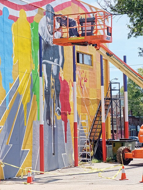 Celebrating ‘the Black Cyclone’-
this new mural in Jackson Ward pays homage to forgotten American cycling superstar — Marshall Walter “Major” taylor. Richmond artist sir James thornhill created the colorful mural featuring the two-wheel racing phenom. Location: 1st and Marshall streets. Dubbed “the Black Cyclone,” Mr. taylor broke the color barrier in the sport in the 1890s when bike racing was a big deal in this country and Europe. Despite bigoted competitors attempts to injure him, he ranked as the fastest cyclist in the world into the early 1900s. the cycling Hall of Famer set seven world records and won 117 of his 168 races, while placing second in the rest. He reportedly earned $30,000 a year in his prime, an immense sum for the period.