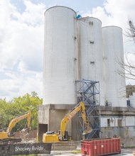 CITYSCAPE-As these photos show, iconic cement silos, left, in the East End have come down. The once proud symbols of Lehigh Cement Co. were demolished in the past two weeks as part of $10 million in improvements the city is undertaking along the north bank of the James River. Winchester-based Howard Shockey & Sons Inc., which did not have any minority partners, cleared the silos, whose site is to be a park. Other projects: The $4 million city portion of the Virginia Capital Trail to which the city contributed $820,000 and the Low-Line Project, a $1.4 million landscaping venture alongside the trail to which the city contributed $200,000 and private sources are donating $1.2 million.