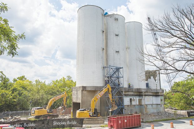 CITYSCAPE-As these photos show, iconic cement silos, left, in the East End have come down. The once proud symbols of Lehigh Cement Co. were demolished in the past two weeks as part of $10 million in improvements the city is undertaking along the north bank of the James River. Winchester-based Howard Shockey & Sons Inc., which did not have any minority partners, cleared the silos, whose site is to be a park. Other projects: The $4 million city portion of the Virginia Capital Trail to which the city contributed $820,000 and the Low-Line Project, a $1.4 million landscaping venture alongside the trail to which the city contributed $200,000 and private sources are donating $1.2 million.