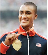 American athlete Ashton Eaton shows off his gold medal in the decathlon last Sunday at the IAAF World Championships at the Bird’s Nest stadium in Beijing.
