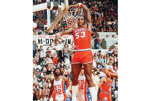 
Darryl Dawkins, aka “Chocolate Thunder,” slams home a dunk for the Philadelphia 76ers in a 1980 game against the New Jersey Nets.