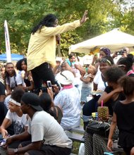 Michael Jackson impersonator Rico entertains at the children's pavilion.