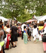 Shoppers enjoy food, jewelry, arts and crafts at the festival.
