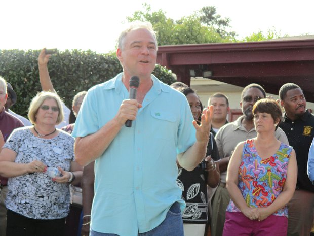 Party with Politics-The event drew nearly 1,000 people, including more than 50 politicians from around the state. Many already hold elected office and are seeking re-election, while others are running for seats ranging from the Virginia House of Delegates to county sheriff and school board. At left, U.S. Sen. Tim Kaine, pumps up the crowd, with his wife, state Secretary of Education Anne Holton, looking on. 