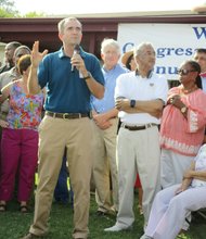 Party with politics- Labor Day marks the kickoff of the political season. And for the 39th year, politics was the main dish at Congressman Robert C. “Bobby” Scott’s annual Labor Day picnic at his family home in Newport News. Lt. Gov. Ralph S. Northam, who is planning a run for governor in 2017, addresses the crowd, with Attorney General Mark Herring, Rep. Scott and state Sen. Mamie Locke, chair of the Virginia Legislative Black Caucus, nearby. 